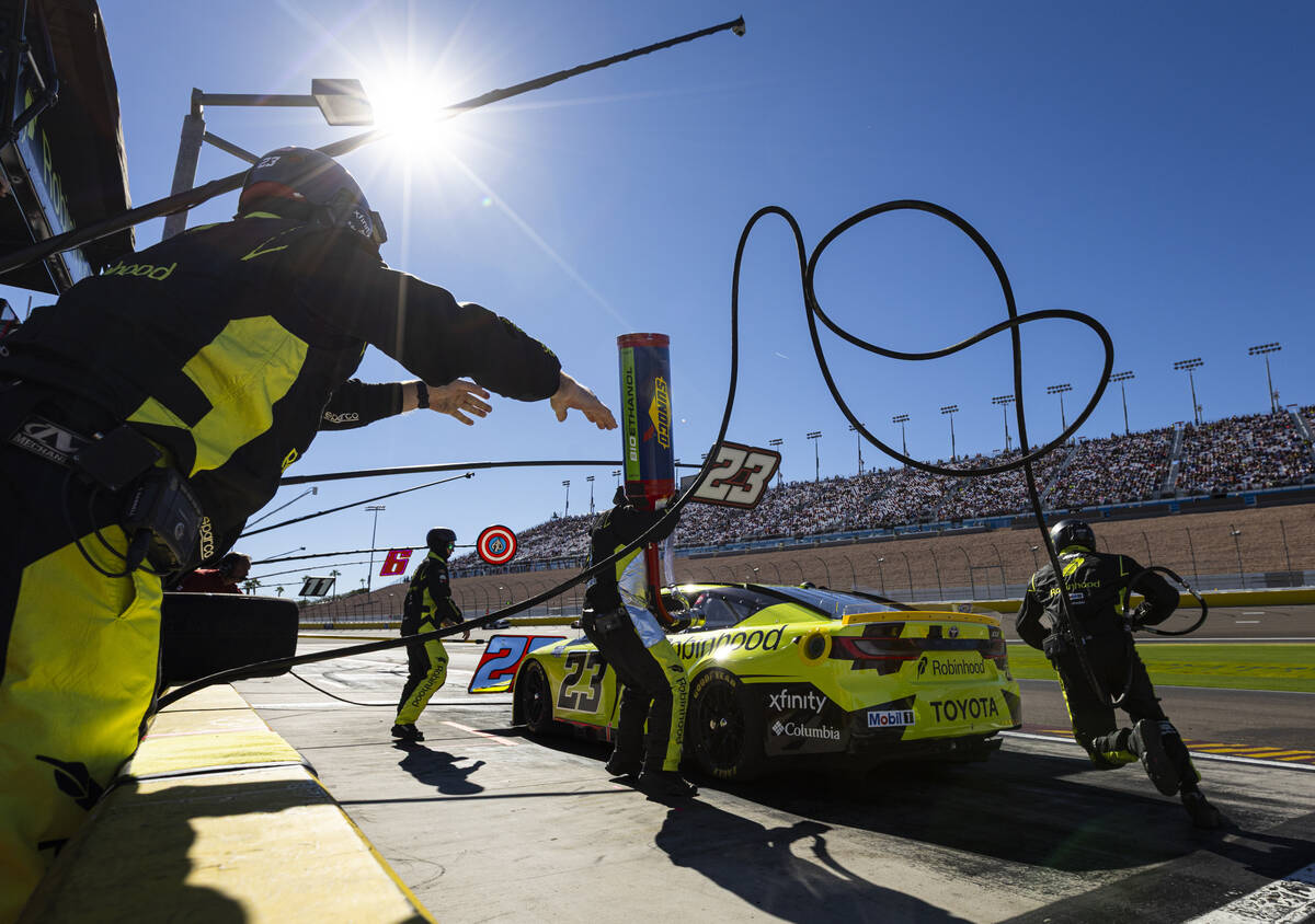 Driver Bubba Wallace (23) pits during the South Point 400 NASCAR Cup Series auto race at Las Ve ...